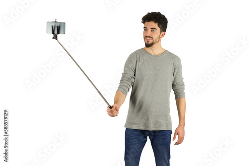 Casual man using a selfie stick