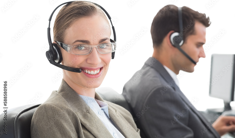 Business people with headsets using computers Business people with headsets using computers