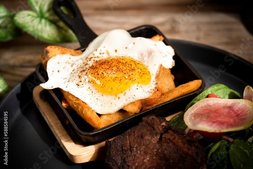 beef steak on a plate with vegetables