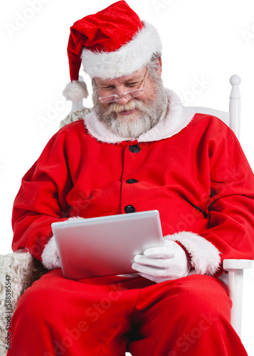 Santa Claus playing games on digital tablet