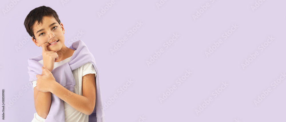 Little boy biting nails on lilac background with space for text Little boy biting nails on lilac background with space for text