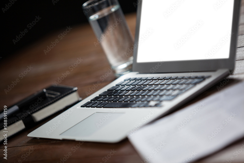 Laptop and glass of water Laptop and glass of water