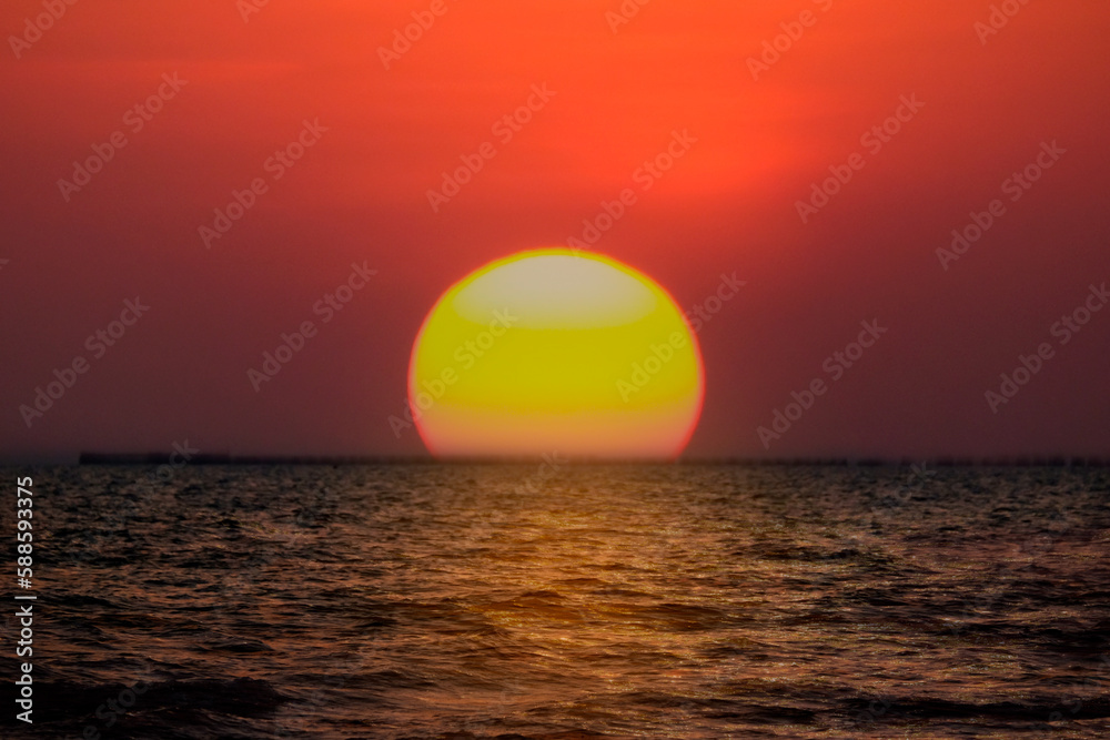Background Sunset sky in the evening with orange-yellow over tropical sea coast paradise island sea nature Background Sunset sky in the evening with orange-yellow over tropical sea coast paradise island sea nature