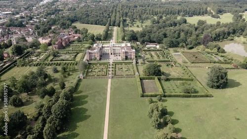 Hatfield House From South Gardens On A Sunny Day In Hatfield, Hertfordshire, England. - aerial approach photo