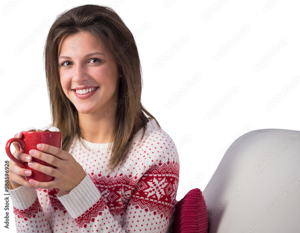 Smiling cute brunette holding cup of coffee sitting on sofa Smiling cute brunette holding cup of coffee sitting on sofa