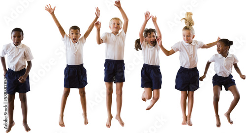 Full length of students in school uniforms jumping