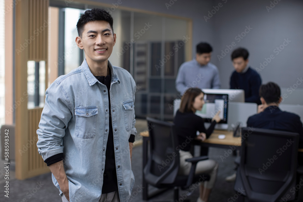 Portrait of Chinese IT worker in office