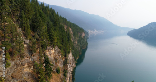 Idyllic shot of mountain by river