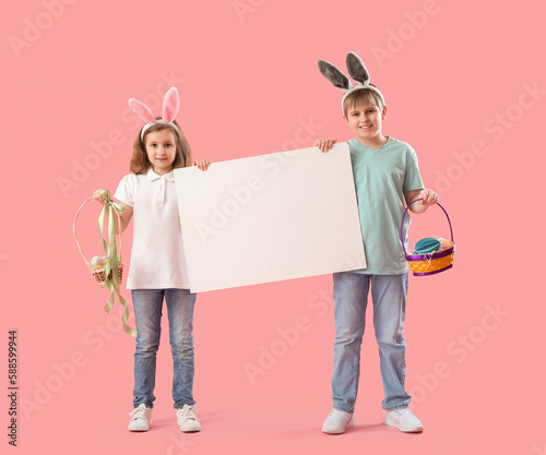 Little children in bunny ea...