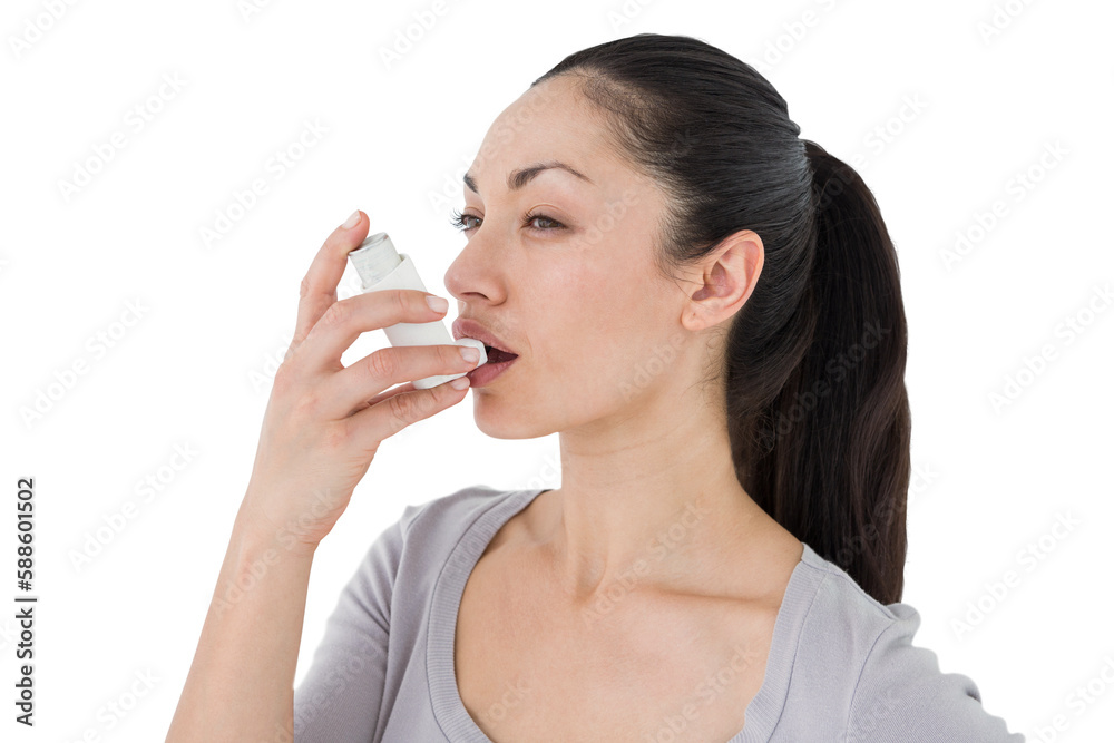 Asthmatic pretty brunette using inhaler Asthmatic pretty brunette using inhaler