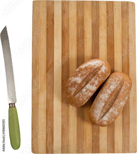 Bread on cutting board with knife