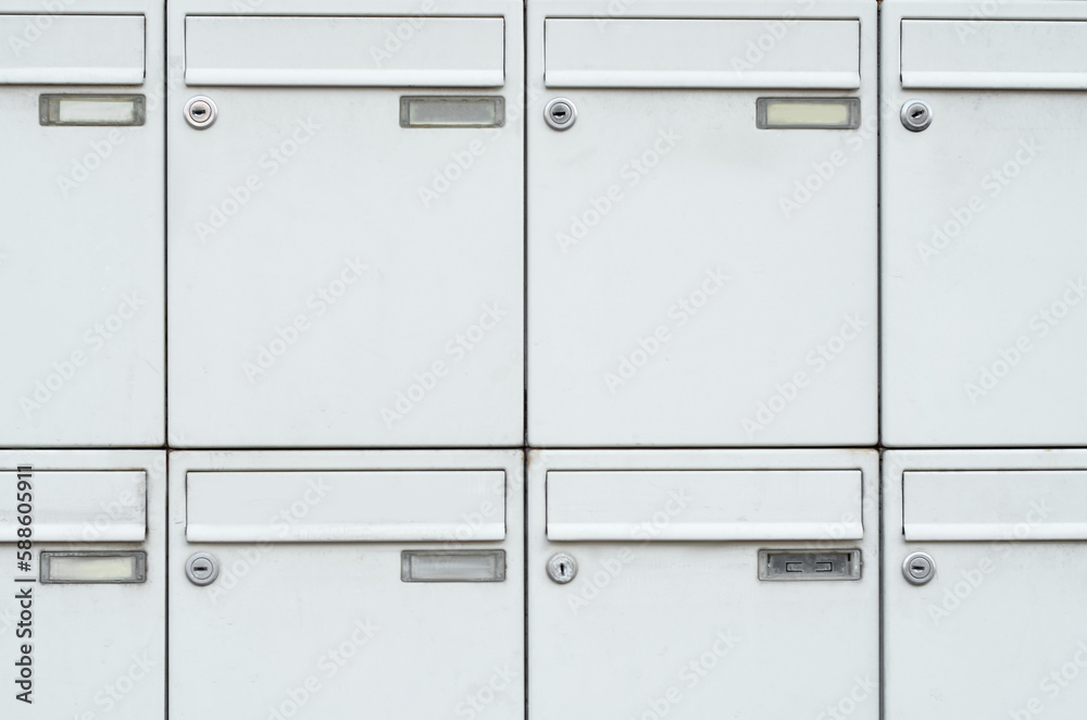 View of white mailboxes outdoors, closeup View of white mailboxes outdoors, closeup