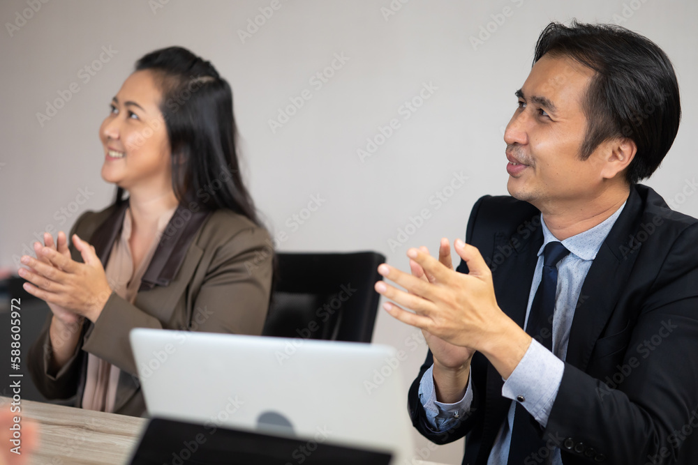 Professional team Business people clapping and applause in business meeting. Asian business man and woman working office. Professional team Business people clapping and applause in business meeting. Asian business man and woman working office.