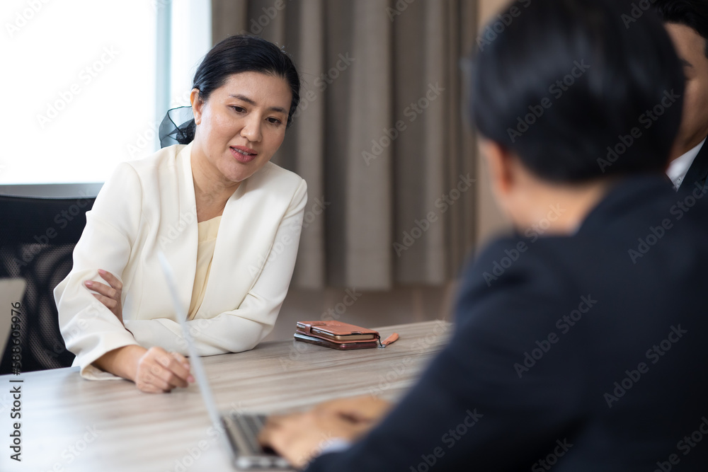Professional business team people and manager in meeting with laptop computer. Asian business man and woman Professional business team people and manager in meeting with laptop computer. Asian business man and woman