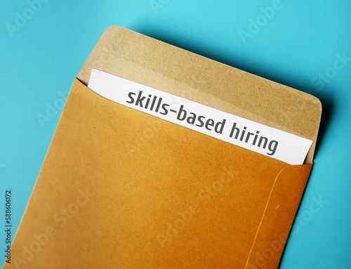 Office envelope and document written Skills-based Hiring - refers to practice of employers setting specific skill, emphasis potential employees rather than on degrees photo