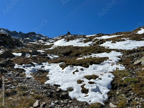 The melting of fresh autumn snow in the wonderful environment of the Swiss mountain massif Abula Alps, Zernez - Canton of Grisons, Switzerland (Kanton Graubünden, Schweiz)
