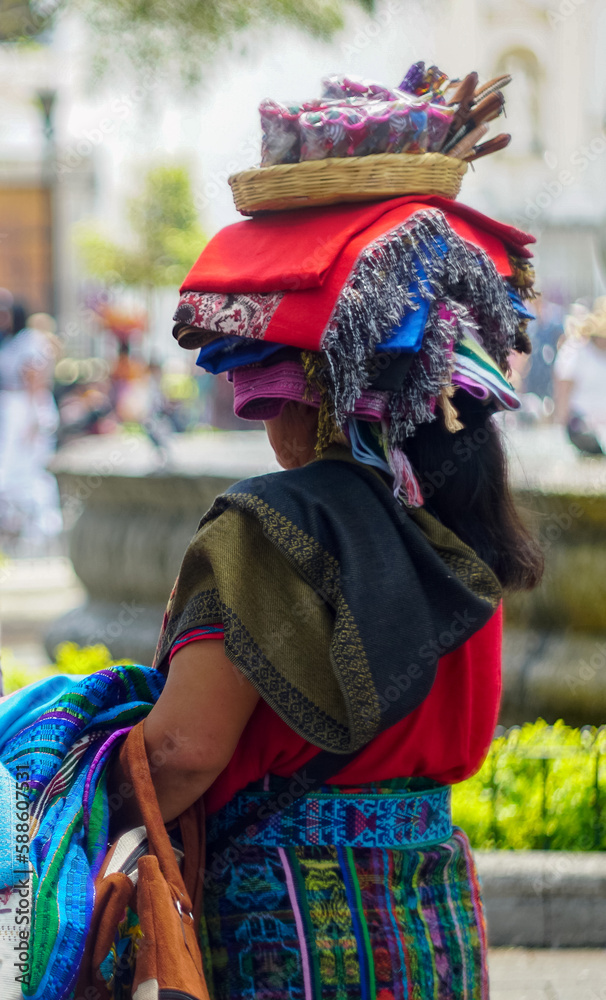 Entrepreneur woman selling handicrafts in Antigua Guatemala park
