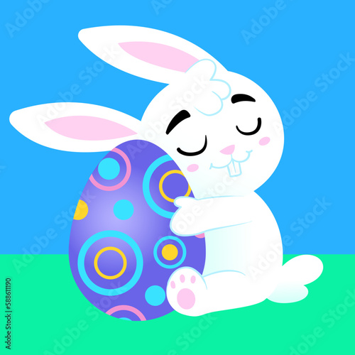 
cute bunny hugging a colorful easter egg photo