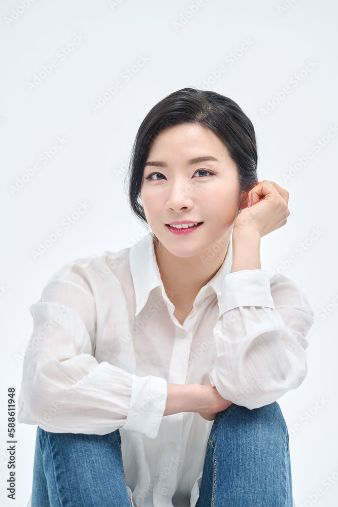 beautiful woman in blue jeans with a white background beautiful woman in blue jeans with a white background