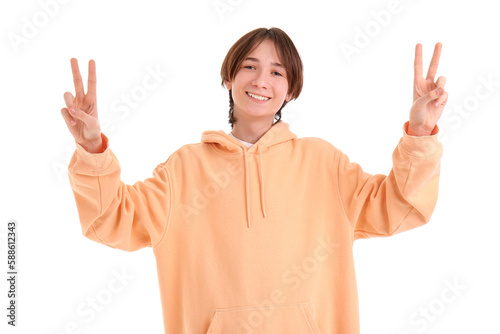 Teenage boy showing victory...
