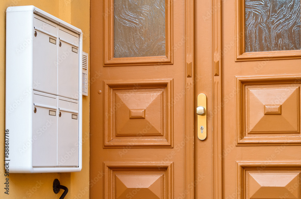 View of mailbox near door in city, closeup View of mailbox near door in city, closeup