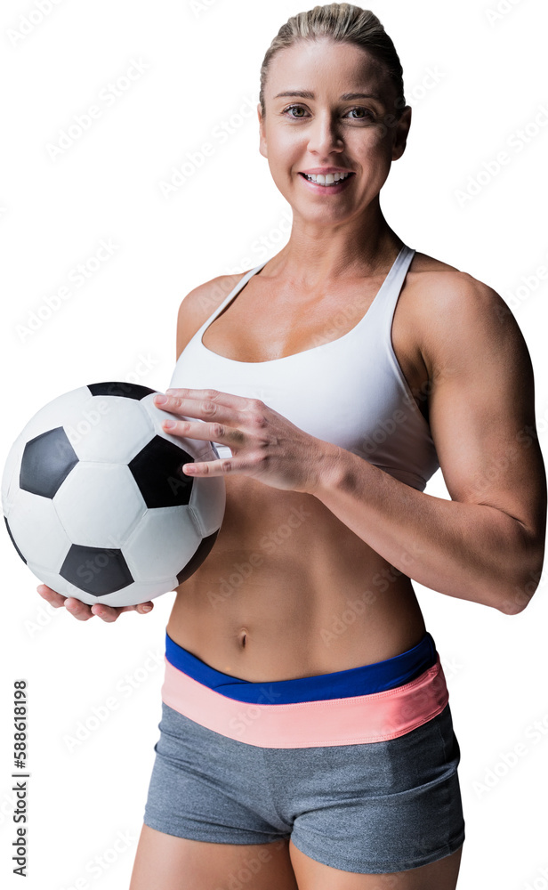 Female athlete holding a soccer ball Female athlete holding a soccer ball