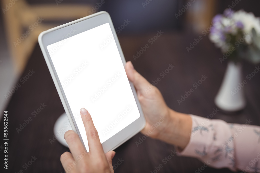 Close-up of woman hands using digital tablet