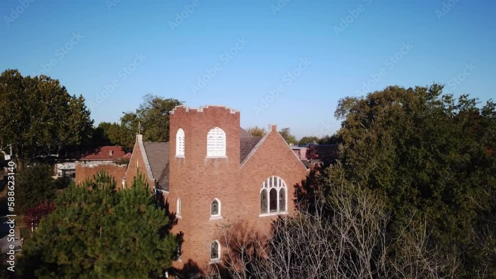 Aerial shot of a stunning red brick church in downtown Georgia Aerial shot of a stunning red brick church in downtown Georgia