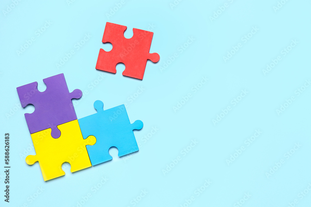 Puzzle pieces on blue background. World Autism Awareness Day Puzzle pieces on blue background. World Autism Awareness Day