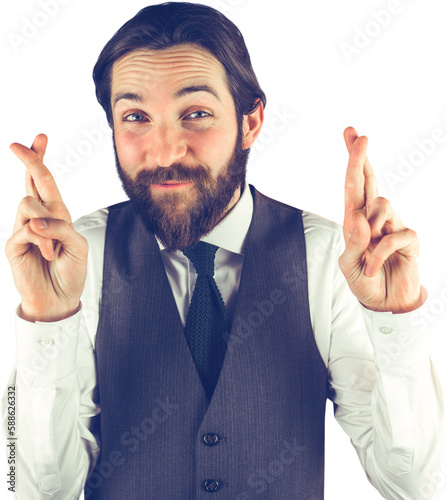 Portrait of smiling businessman with fingers crossed