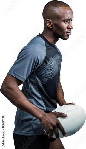Confident sportsman with rugby ball