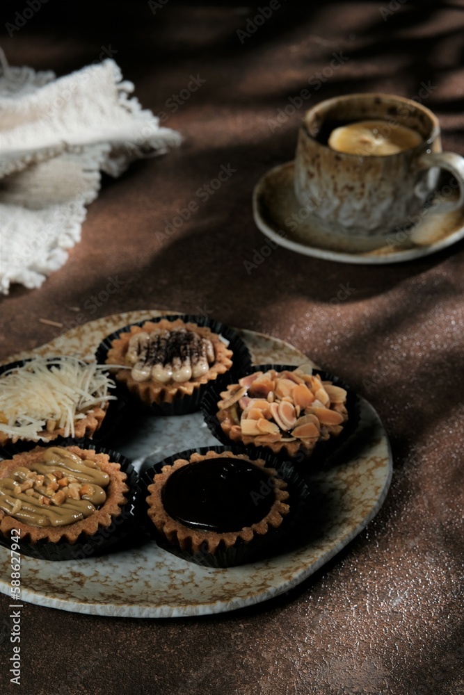 Pie on rustic plate with brown background. Mix topping Pie on rustic plate with brown background. Mix topping