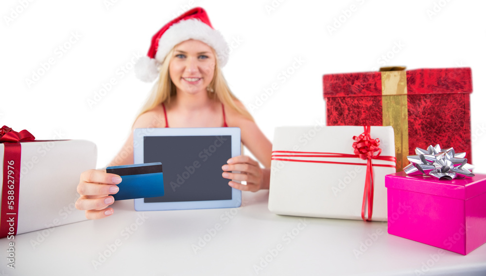 Festive blonde shopping online with tablet pc Festive blonde shopping online with tablet pc