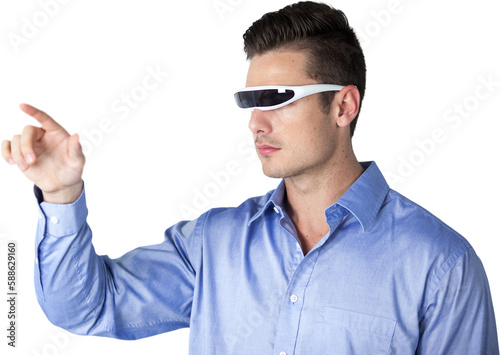 Young man pointing while using virtual video glasses
