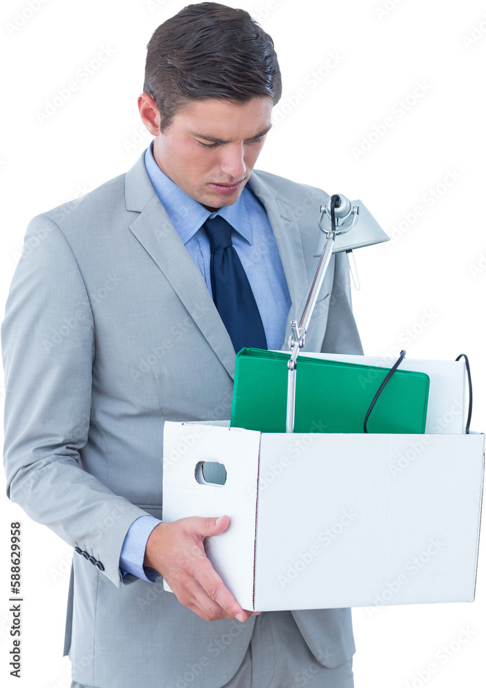 Fired businessman holding box of belongings Fired businessman holding box of belongings