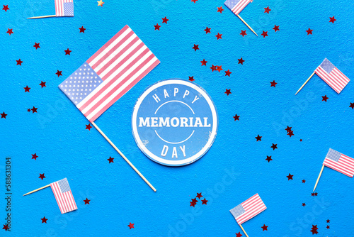Greeting card with text HAPPY MEMORIAL DAY, USA flags and stars on blue background