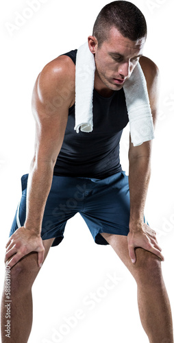 A tired man with towel on his shoulders