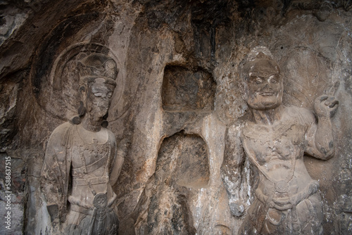 The Longmen Grottoes with Buddha's figures are located on both banks of the Yi River, near Luoyang City, Henan province, China. Protected by UNESCO.