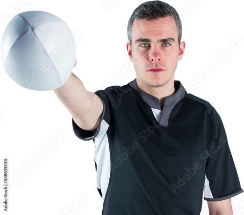 Portrait of serious rugby player holding ball