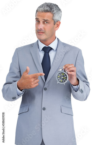 Quadro em tela Businessman holding alarm clock