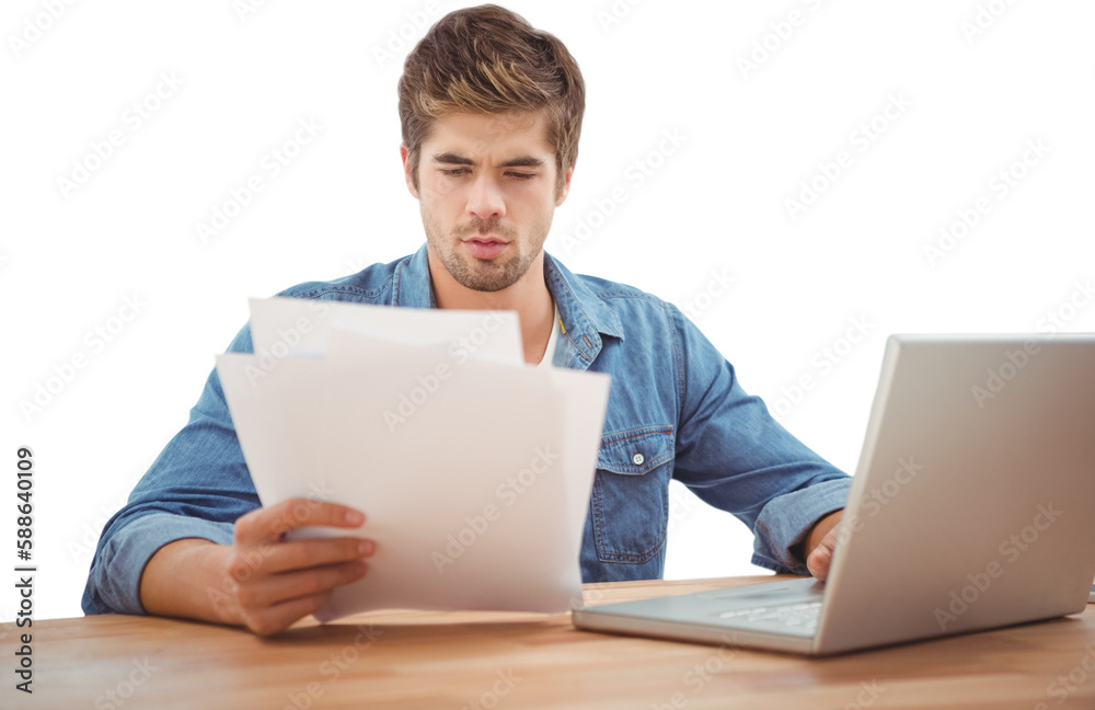 Hipster looking at documents while sitting at desk Hipster looking at documents while sitting at desk