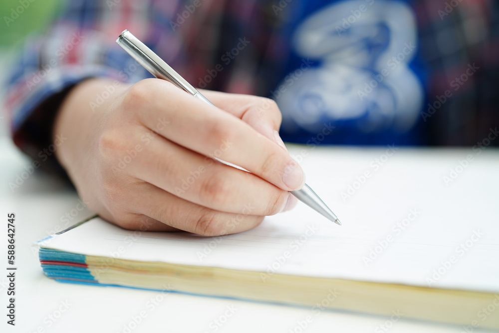 Asian teenage student write homework, study lesson for exam online learning education. Asian teenage student write homework, study lesson for exam online learning education.