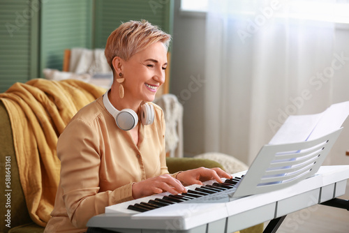 Mature female musician play...