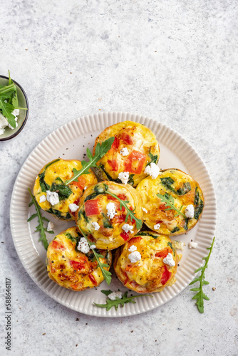 Delicious egg muffins with pepper, feta cheese and spinach