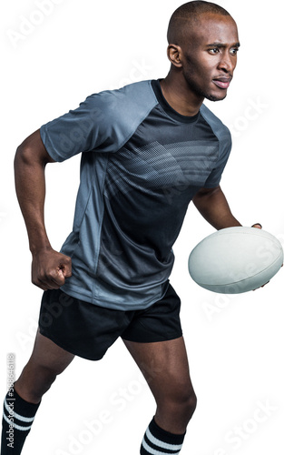 Sportsman running with rugby ball