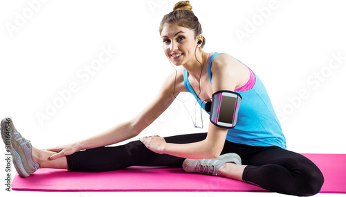 Portrait of fit woman exercising on mat 