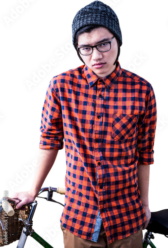 Serious hipster holding a bike