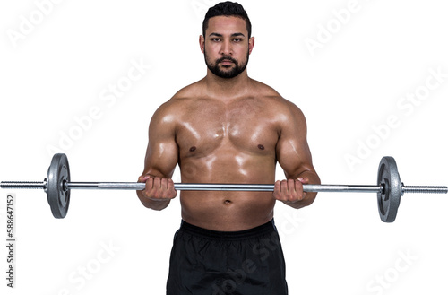 Muscular man lifting heavy barbell