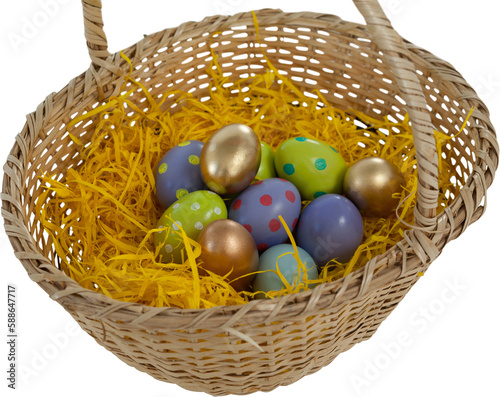 Multi colored easter eggs in basket nest