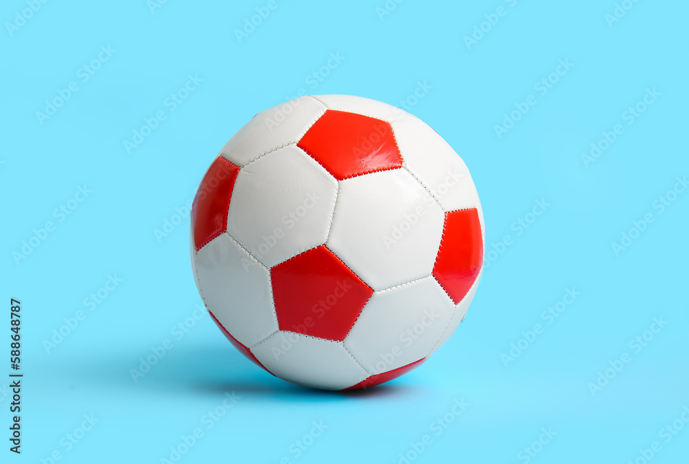 Fototapeta premium Soccer ball on light blue background